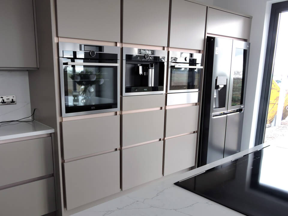 Kitchen cupboards with built-in coffee machine