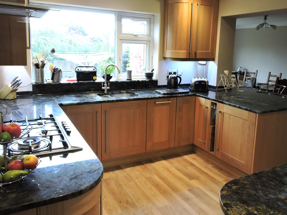 Wooden kitchen with granite worksurface
